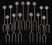 A set of fourteen Chinese silver olive forks : of traditional design with simulated bamboo shafts,