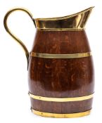 An oak and brass bound pitcher:, of barrel shape with brass scroll handle.