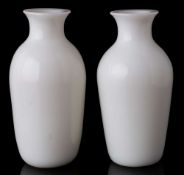 A pair of Chinese Peking white glass vases: of baluster form with flattened rims, 11cm.