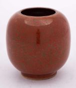 A Chinese 'iron-rust' glazed vase: of squat globular form with short cylindrical foot rim,