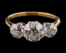 A diamond three-stone diamond ring: with round old brilliant-cut diamonds in curtain-claw settings,