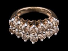 A diamond mounted tiered two-row half-hoop ring: with circular brilliant-cut diamonds estimated to
