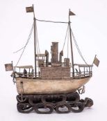 A Chinese silver model of a Yangtze river steamer: with tall funnel,