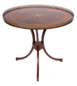 A 19th Century Russian mahogany and brass inlaid circular centre table:, bordered with brass lines,