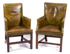 A pair of Georgian mahogany and leather club armchairs:, of square form,