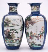 A pair of Chinese famille rose/verte vases: of ovoid form with waisted necks and flared rims,
