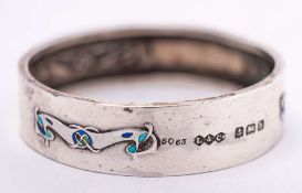 Liberty & Co, A silver and enamel napkin ring, Birmingham, 1907: with stylised sinuous motifs,