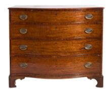 A George III mahogany serpentine-fronted chest:, the top with a moulded edge,