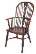 A 19th Century yew wood and elm stick back windsor elbow chair:,