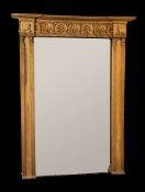A fine Regency giltwood and gesso overmantel mirror:, of large size in the Egyptianesque manner,