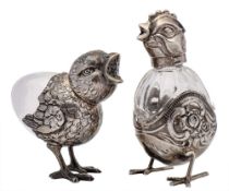 A Continental clear glass and silver mounted scent bottle, stamped 800: in the form of a chick 6.