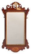 A late 19th Century mahogany, inlaid and partly gilt fret cut mirror:,
