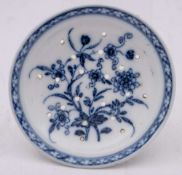 A Bristol blue and white small strainer: painted with two flowering sprays within a lattice border,