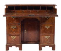 An early 18th Century walnut and cross and feather banded secretaire kneehole desk:,