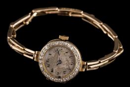A lady's 18ct gold and diamond-set wristwatch: the circular dial with Arabic numerals,