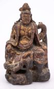 A Chinese carved gilt and polychrome wood figure of an Emperor: on raised throne with dragon to