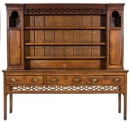 A late 18th Century oak and inlaid dresser:, bordered with boxwood lines,