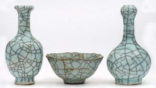 Two Chinese Guan-type vases and a similar bowl: covered with pale blue crackled glazes,
