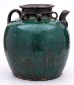 A Chinese green crackle-glazed earthenware globular jar: with short spout and loop handle, 27cm.