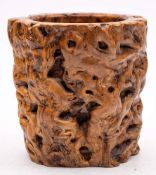 A Chinese rootwood brushpot: of cylindrical naturalistic design, 21cm. diameter, 23cm. high.