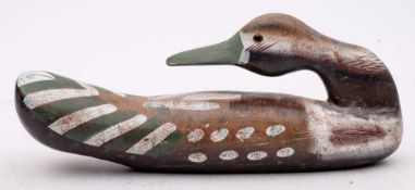 A carved wood and polychrome decorated decoy Pintail duck: overall length 35cm.