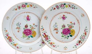 A Chinese famille rose charger: painted with a central scroll panel of peonies and other flowers on