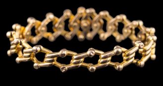 A 15ct gold bracelet of expanding concertina linking: stamped 'Baden' and '15',