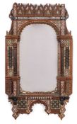 A pair of Damascus inlaid beech wall mirrors: of arched design, inlaid with mother of pearl,