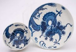 A Lowestoft blue and white teabowl and saucer: painted with the 'Dragon' pattern of a coiled dragon