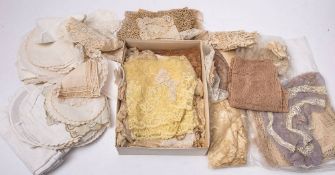 A quantity of early 20th century lace:,including edging and trim, also a group of later textiles.