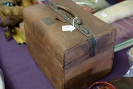 An early 20th century brown pigskin Gladstone bag style vanity case: with fitted interior and