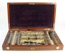 An early 20th century mahogany cased options optometrist test set: stamped 'Eduard Messier,