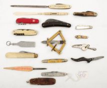A collection of various penknives: including a Bakelite shoe (damaged) a silver penknife by George