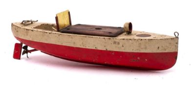 A Sutcliffe pre-war clockwork motor launch: white over red hull with mahogany engine cover and fold