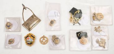 A collection of gold Masonic fobs and badges:,