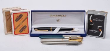 A Waterman black and gilt fountain pen with 18ct gold nib in original box: together with a Parker