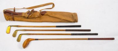 A set of child's golf clubs by Pyramid for Hamleys, London: comprising a brass head putter,