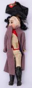 An early 20th century Continental bisque head Napoleon doll: black wig over brown glass eyes,