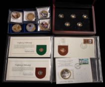 A cased set of six Queen Elizabeth II medallions: with two silver medal stamp covers and a set of