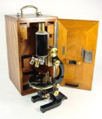 An Ernst Leitz Wetzlar brass and lacquer microscope:, No 209079, signed as per title,