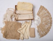 A small collection of lace and kid gloves,