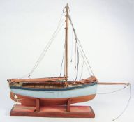A scale model of a Falmouth work boat: standing rigged,