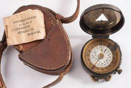 A WWI lacquered brass mirror compass by S Mordan & Co, No.
