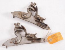 Two plain steel swan neck flintlock actions, unsigned (2).