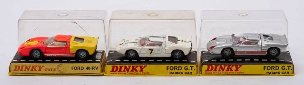 A boxed group of three Dinky racing cars: comprising two Dinky 215 Ford GT Racing Cars,