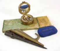 A brass Stanley pattern surveying compass: together with a Marlin spike, a brass boat hook,