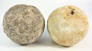 An 18th century granite cannonball together with a similar sandstone cannonball:(2)
