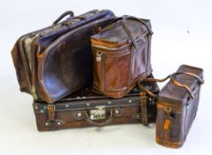 A group of four various leather suitcases and holdall's: (4)