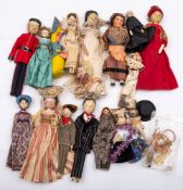 A collection of seven early 20th century and later wooden peg dolls: including a soldier in uniform,