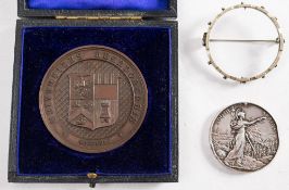 A King's South Africa Medal '56318 Gnr A Brealy RFA' set in a silver plated brooch mount:,